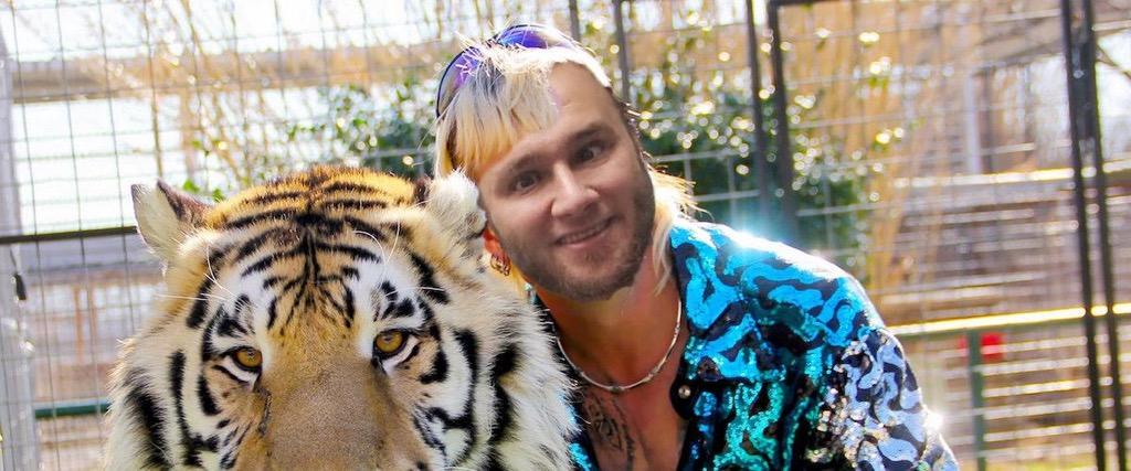 Mat Danish posing TigerKing style with a tiger